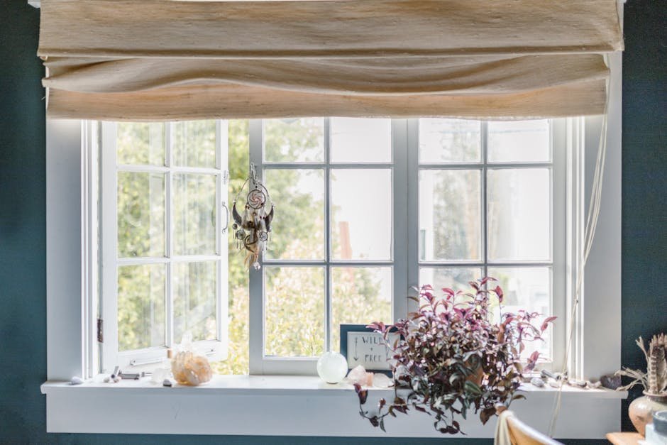 Cozy window with hanging plants and decor